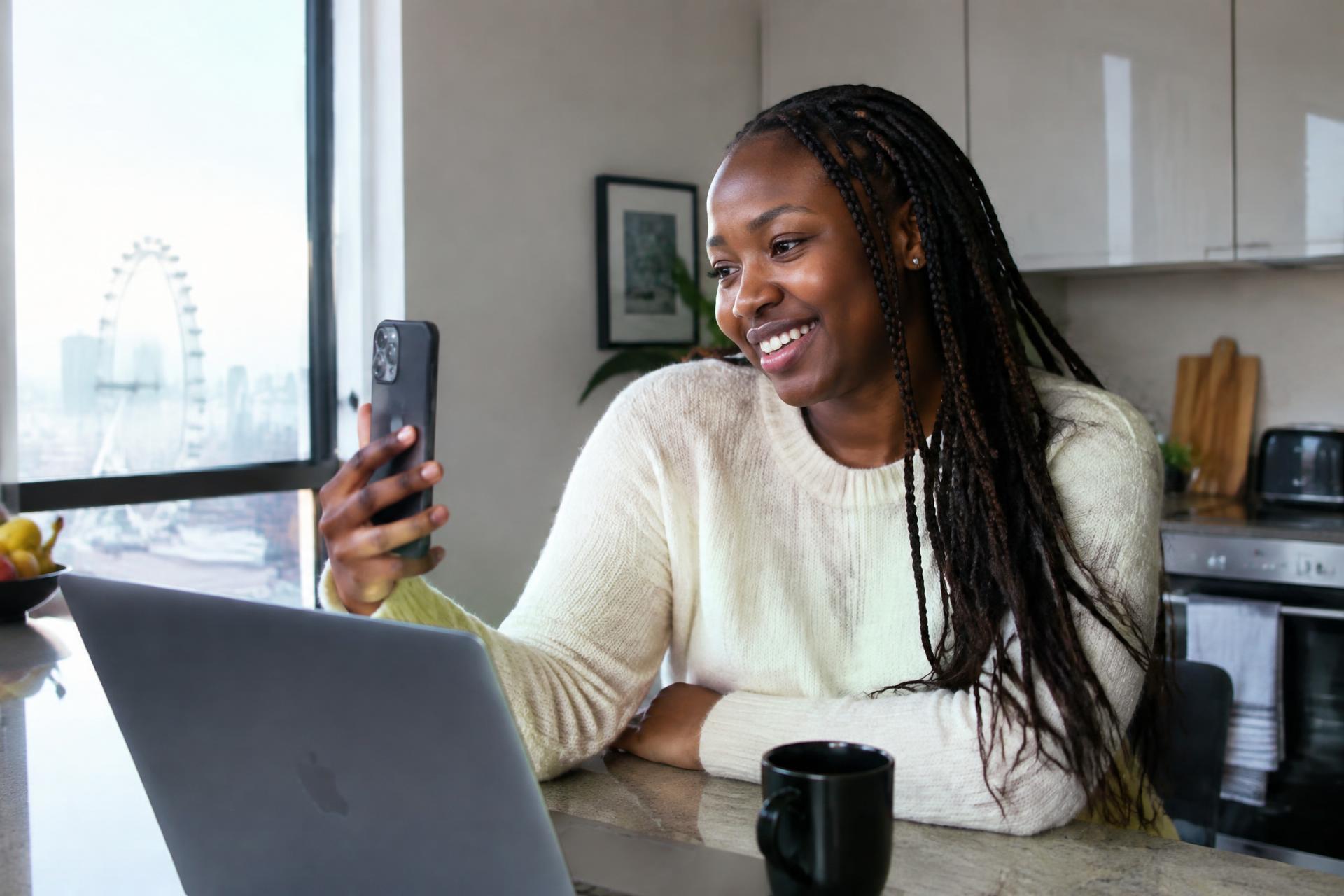 A woman living abroad staying connected with home on her phone